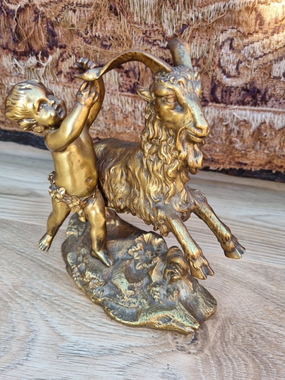 QUALITY 19THC GILT BRONZE OF A CHERUB PLAYING WITH A GOAT 
