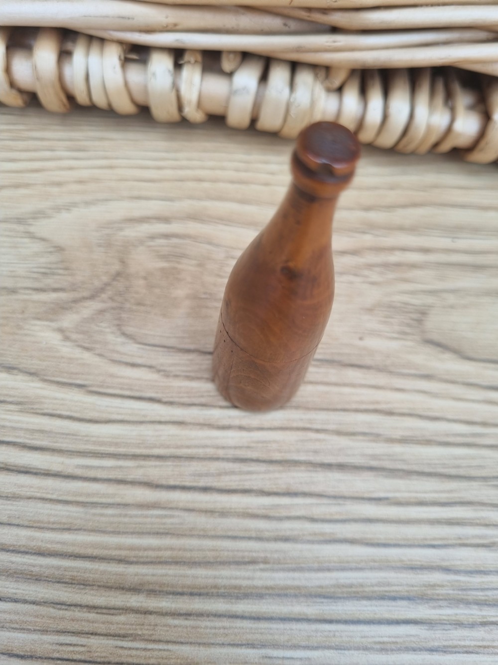 A TREEN DICE SHAKER IN THE FORM OF A WINE BOTTLE View II