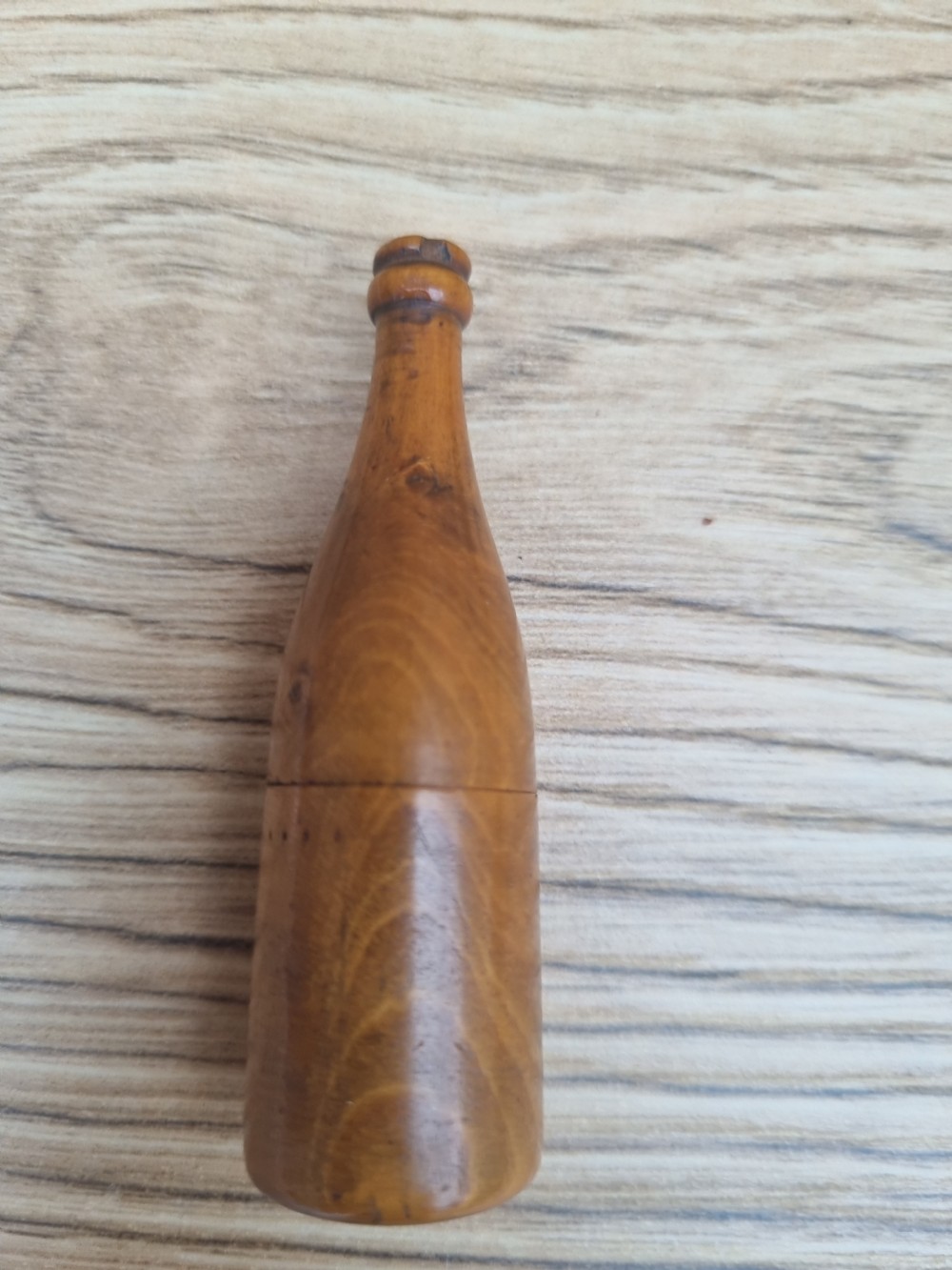 A TREEN DICE SHAKER IN THE FORM OF A WINE BOTTLE View III
