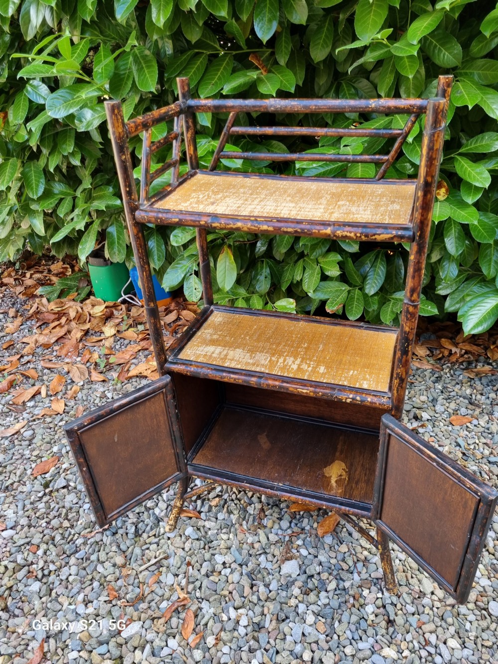 AN ARTS AND CRAFTS  BRITISH BAMBOO STAND WITH CUPBOARD View II