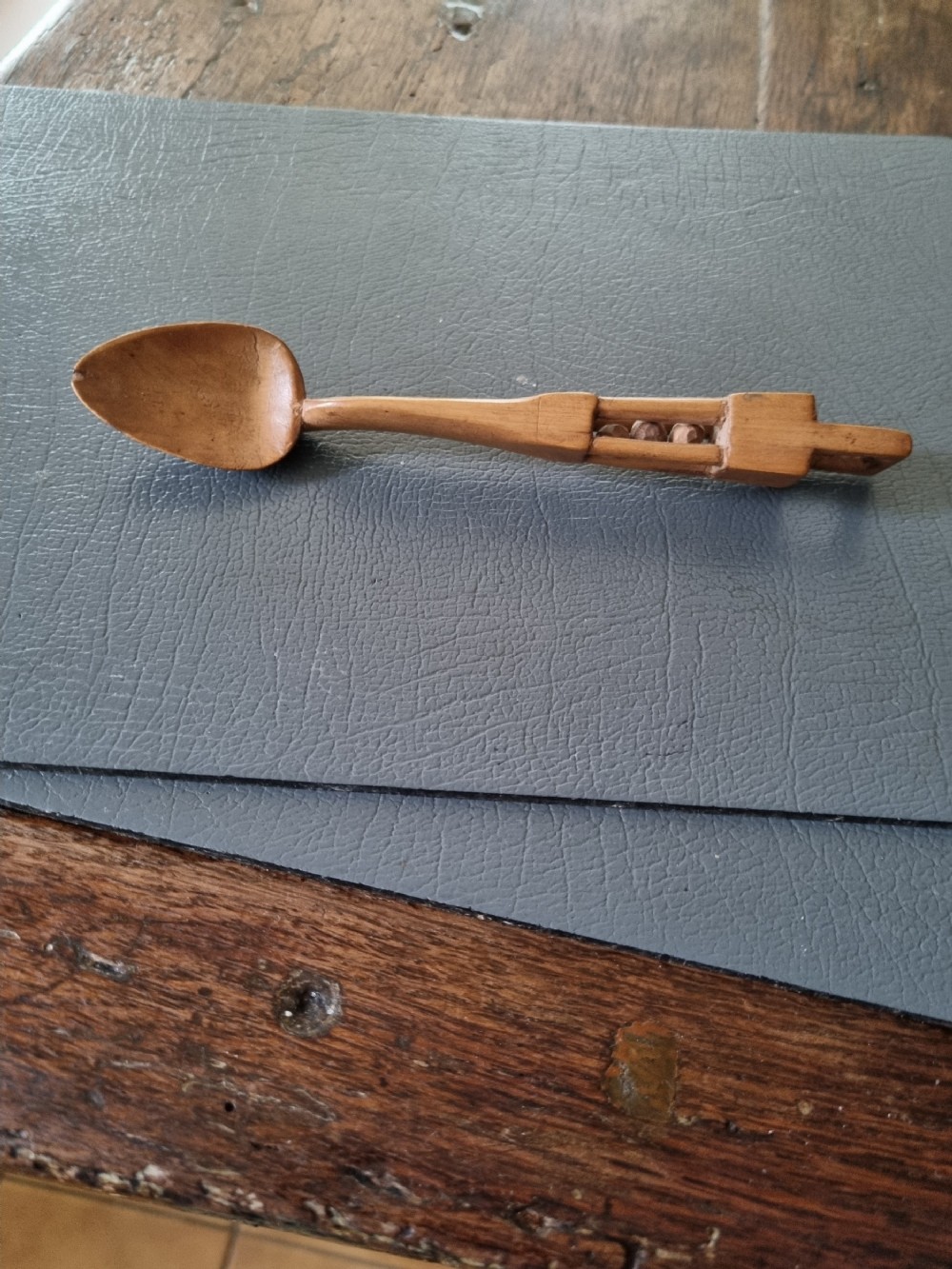 A SMALL ANTIQUE SYCAMORE WELSH LOVE SPOON .