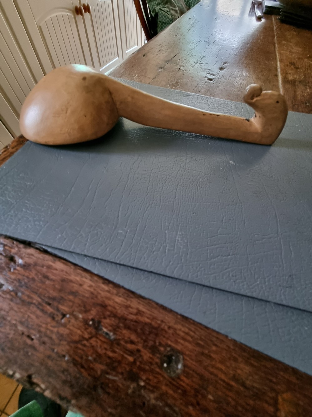 A 19th-century hand-carved Welsh sycamore wooden ladle with a rounded bowl and a hooked handle terminal. View II