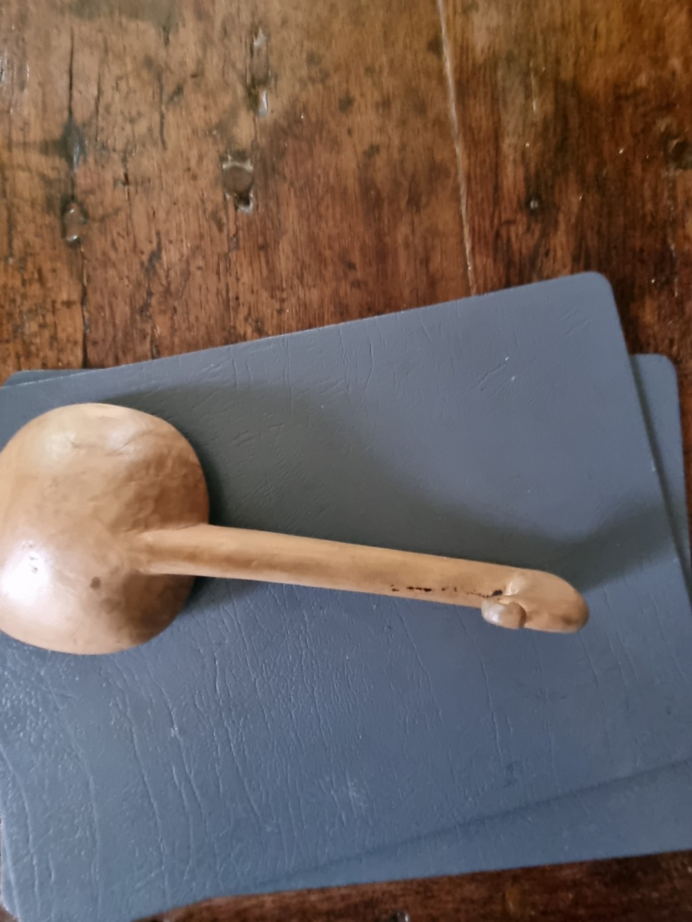 A 19th-century hand-carved Welsh sycamore wooden ladle with a rounded bowl and a hooked handle terminal. View VI