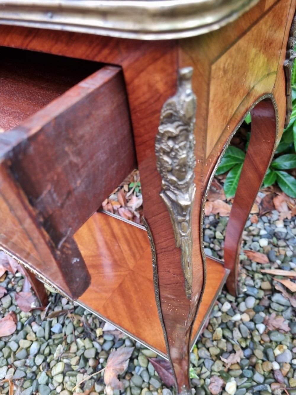 A 19th-century French kingwood side table featuring marquetry inlay, a single drawer, an under-shelf, cabriole legs, and a pierced brass top gallery. View V
