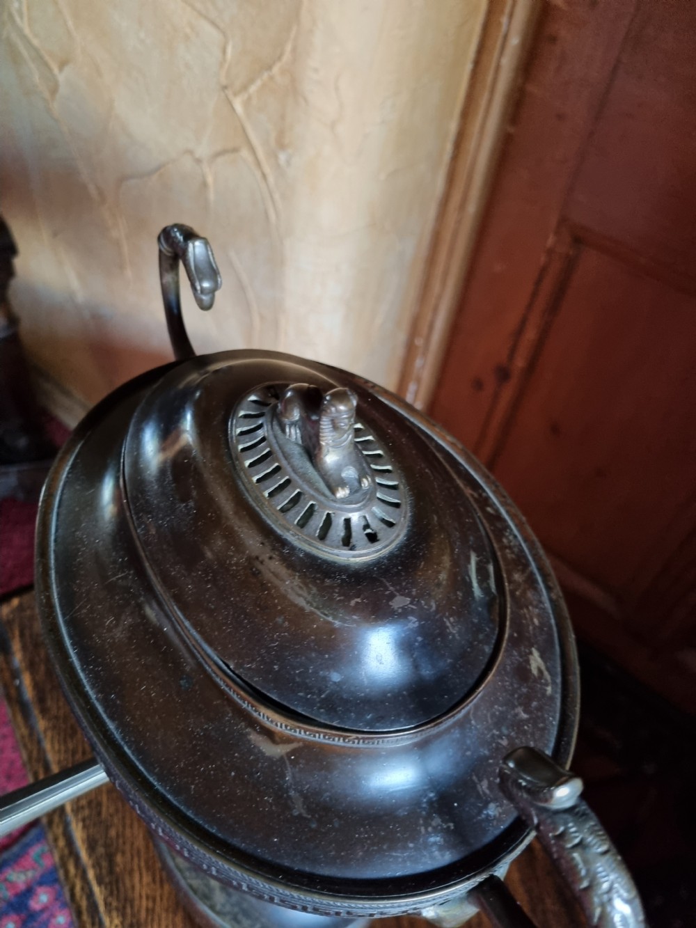 A dark patinated bronze and copper Regency tea samovar featuring a Greek key engraved border, side handles, spigoted tap, and pedestal base. View IV