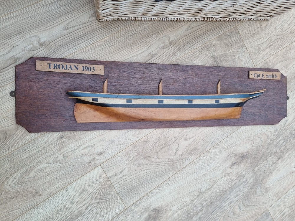 A LARGE DATED HALF BLOCK MODEL OF A SAILING SHIP 
