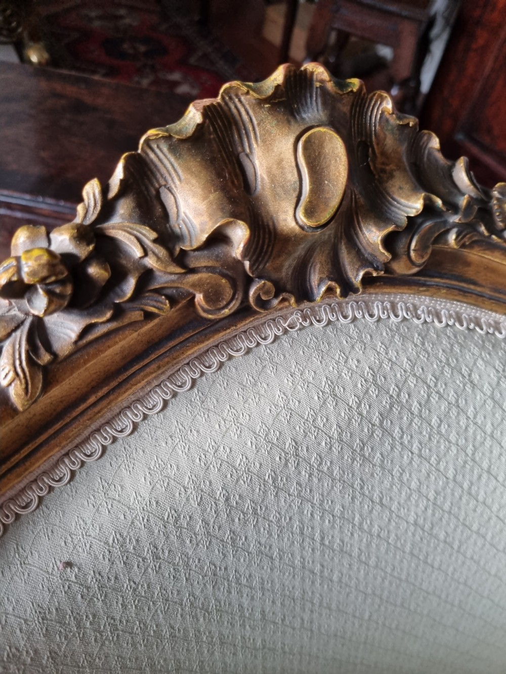 A 19th-century three-piece French duchesse brisee seating set featuring carved giltwood frames and sage green upholstery. View III