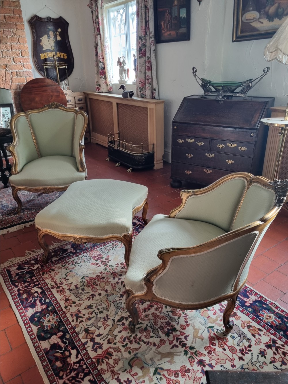 A 19th-century three-piece French duchesse brisee seating set featuring carved giltwood frames and sage green upholstery. View VIII