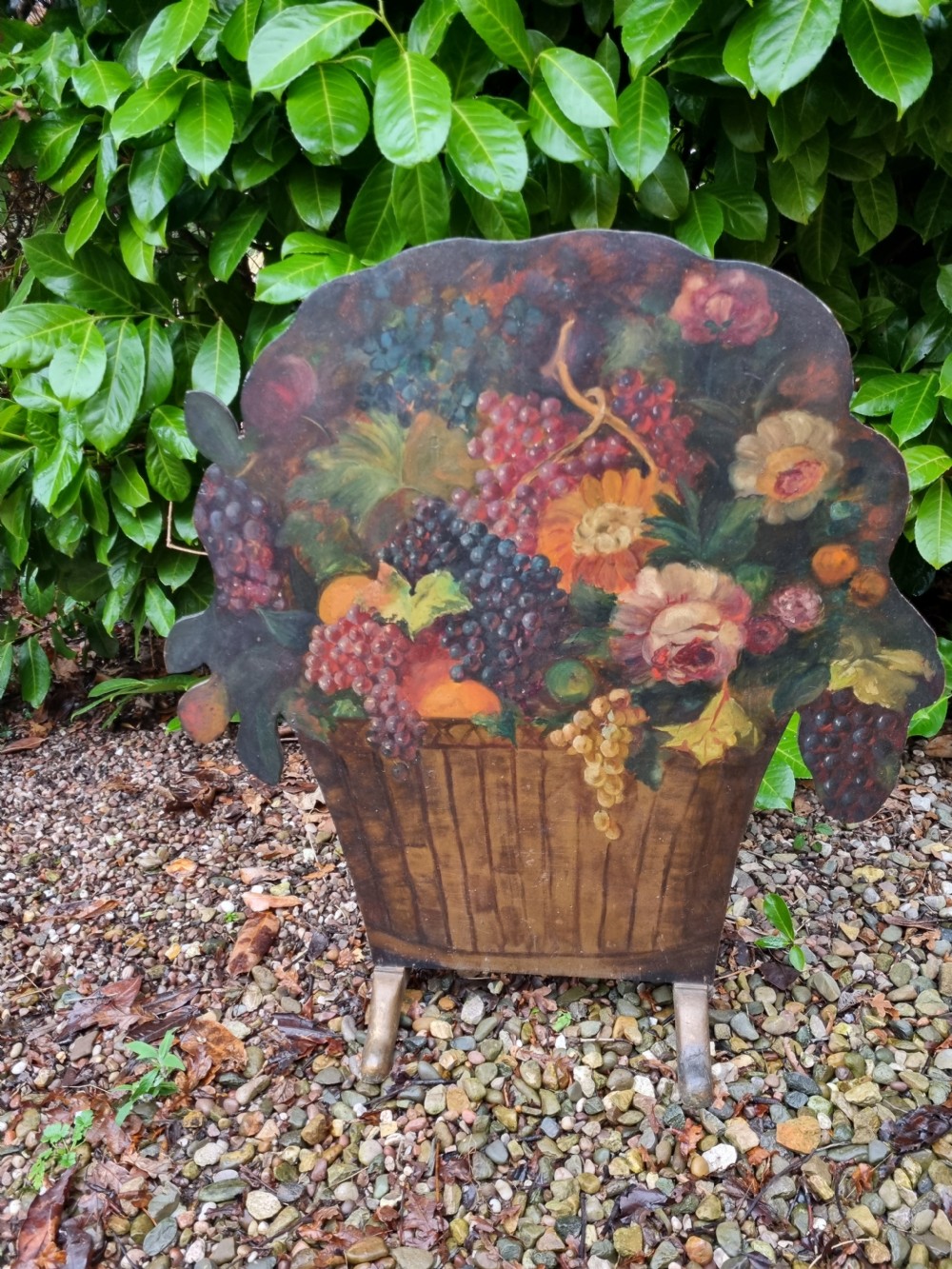 A 19th-century flat wooden dummy board shaped and hand-painted with a still life depicting a basket overflowing with flowers and fruit. View II