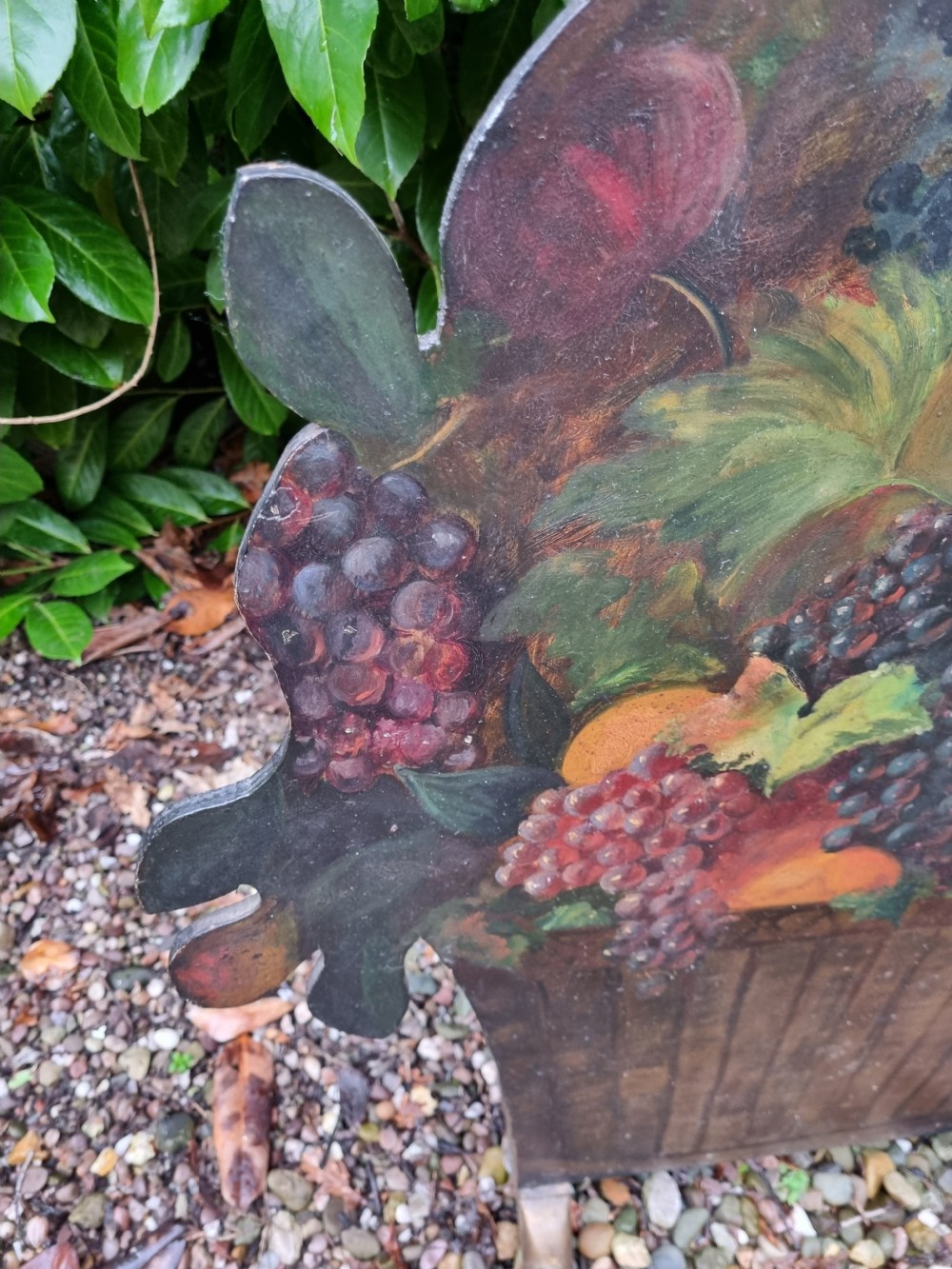 A 19th-century flat wooden dummy board shaped and hand-painted with a still life depicting a basket overflowing with flowers and fruit. View IV