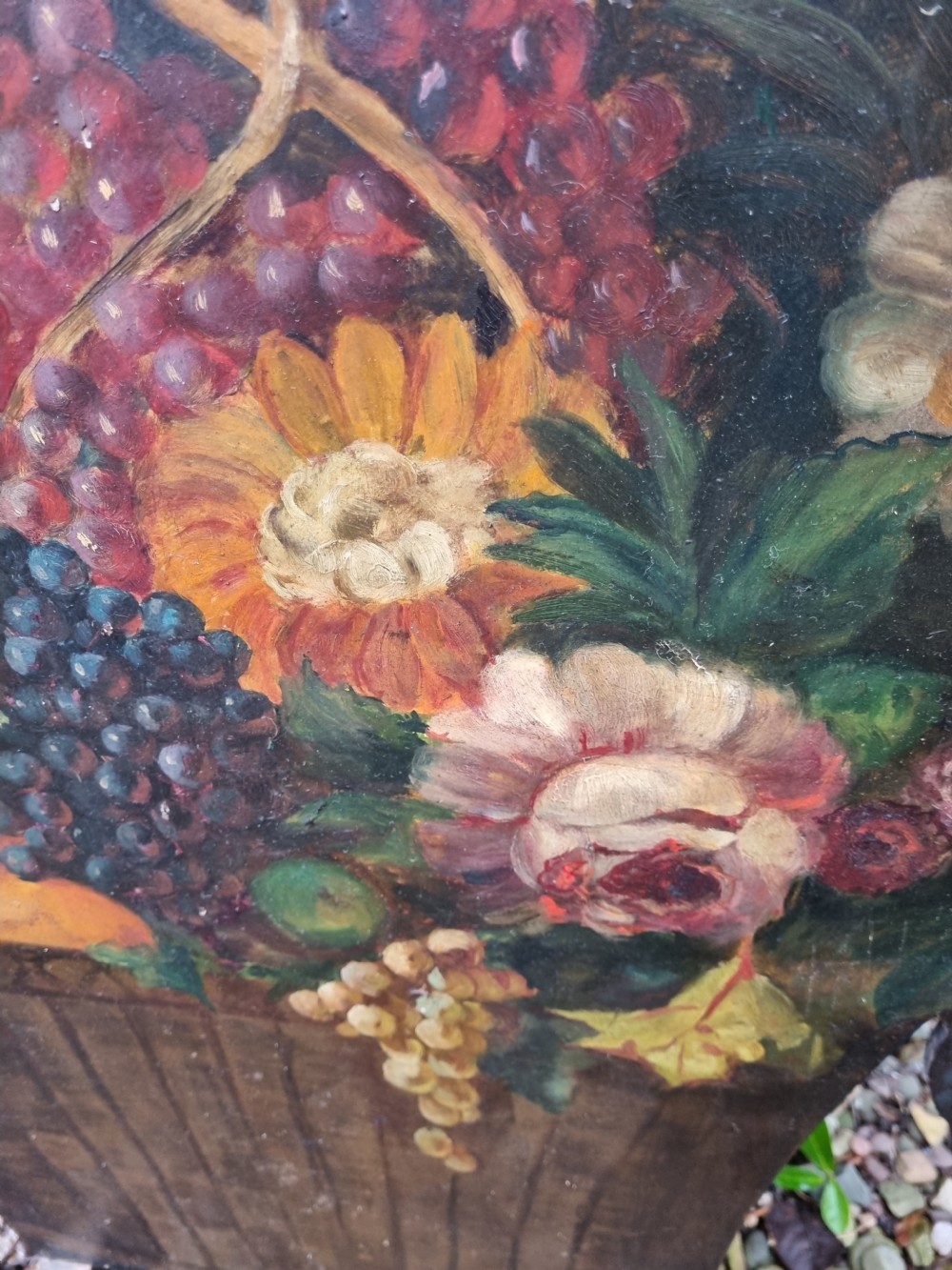 A 19th-century flat wooden dummy board shaped and hand-painted with a still life depicting a basket overflowing with flowers and fruit. View V