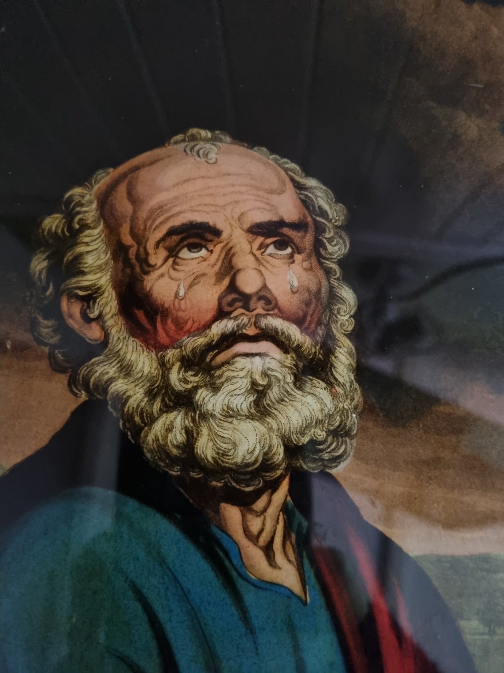 A late eighteenth to early nineteenth-century reverse glass picture depicting Saint Peter with clasped hands inside a moulded wooden frame. View II