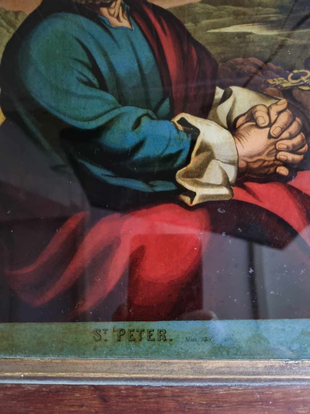 A late eighteenth to early nineteenth-century reverse glass picture depicting Saint Peter with clasped hands inside a moulded wooden frame. View III