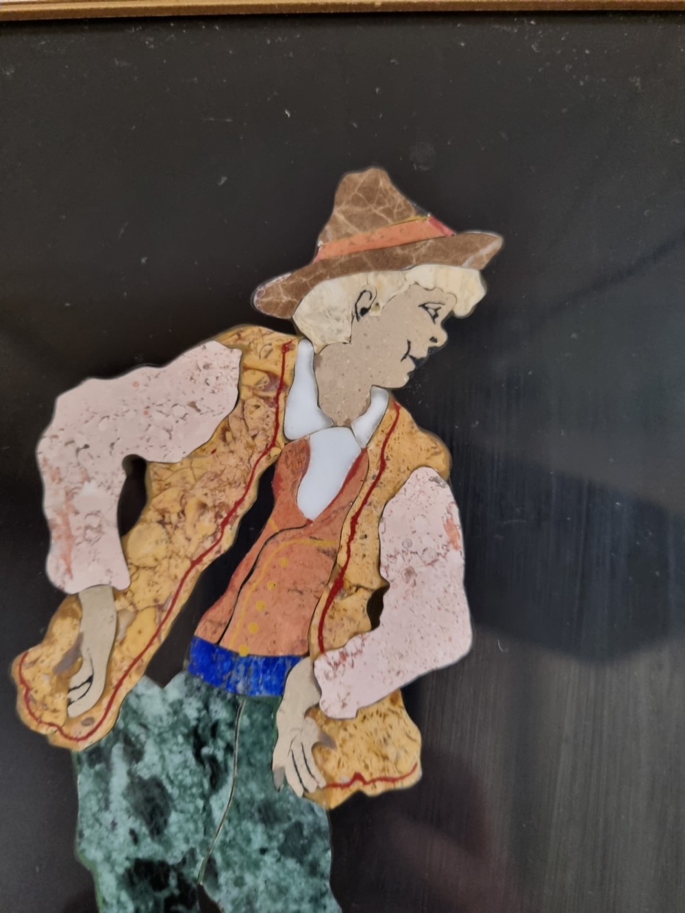 A 19th-century Italian pietre dure mosaic plaque depicting a shepherd boy in traditional dress within a moulded gilt frame. View III