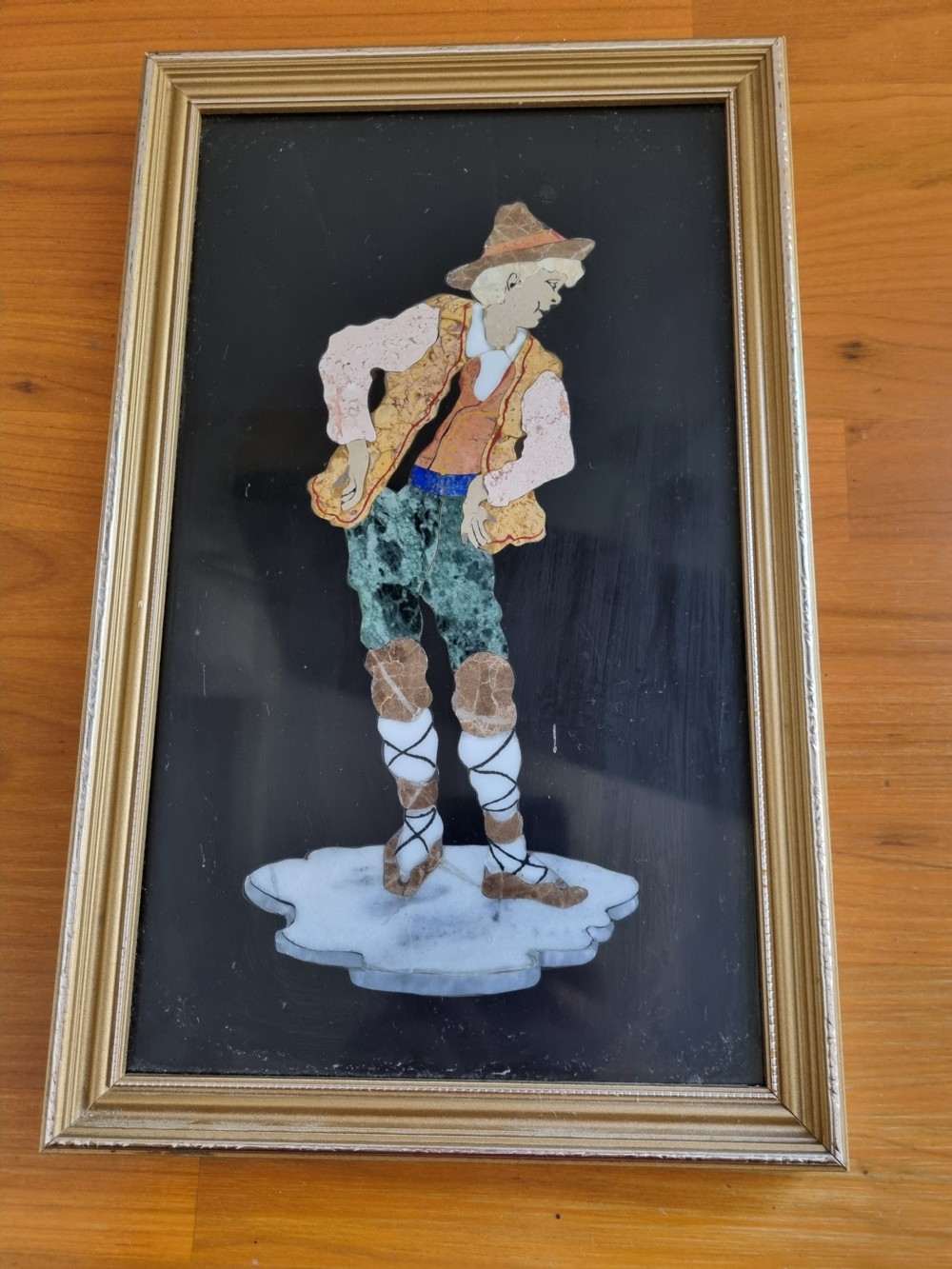 A 19th-century Italian pietre dure mosaic plaque depicting a shepherd boy in traditional dress within a moulded gilt frame. View VIII