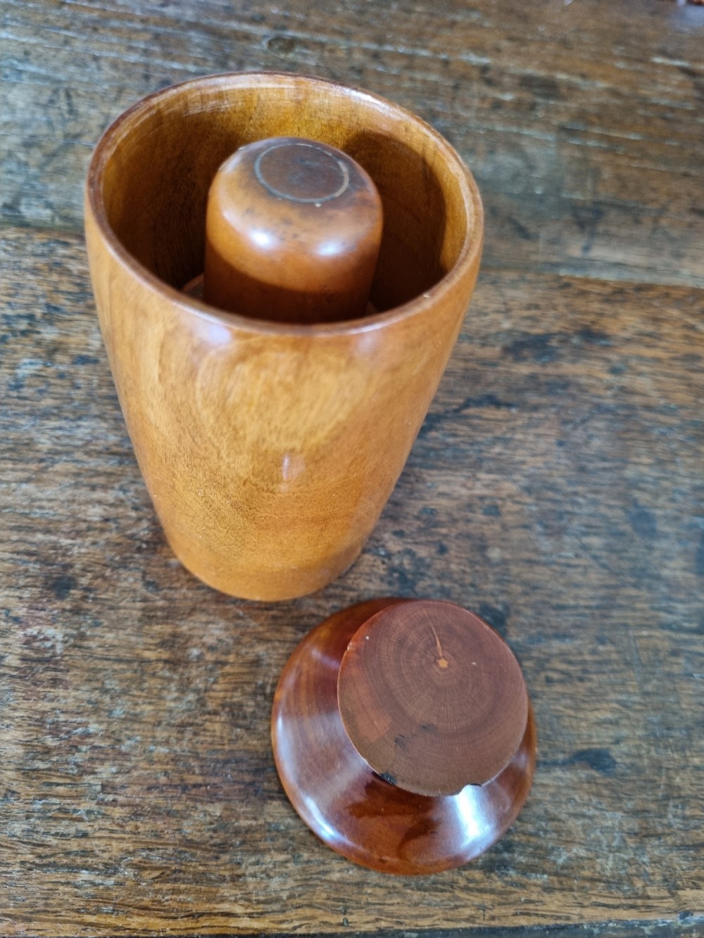 A pair of 19th-century turned sycamore wood jars with fitted covers, displaying a warm honey-brown finish and subtle grain patterns. View II