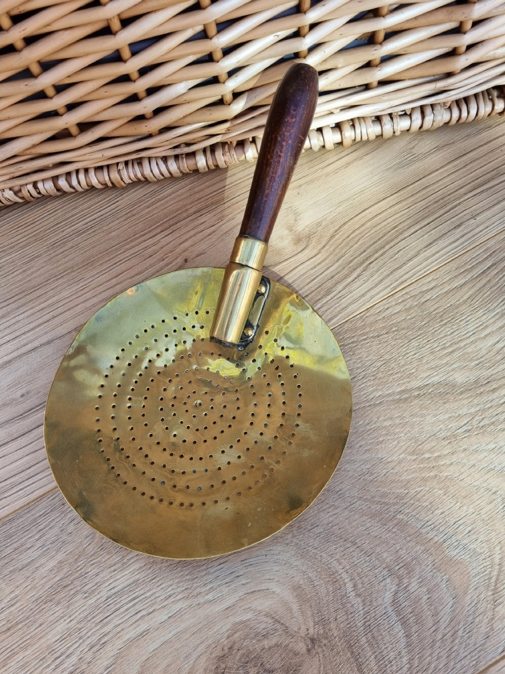 AN UNUSUAL 18THC BRASS HAND HELD MILK SKIMMER 