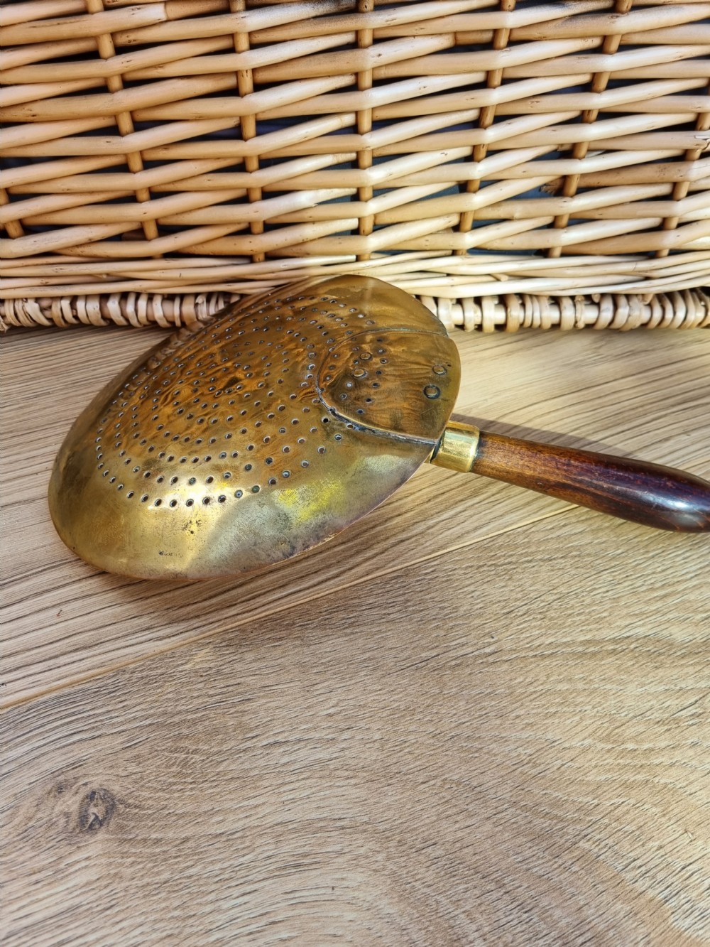 AN UNUSUAL 18THC BRASS HAND HELD MILK SKIMMER  View II