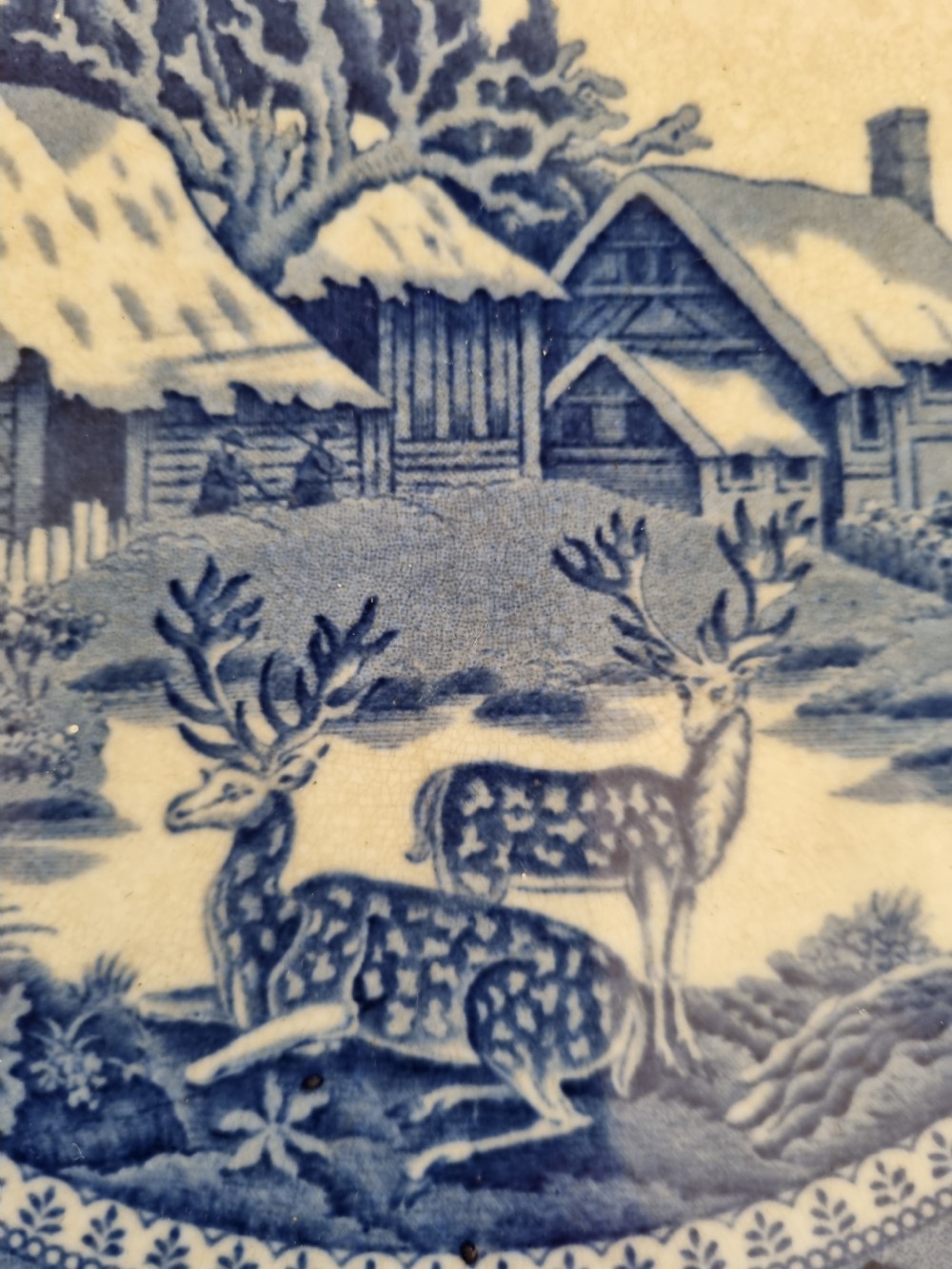 A set of four 19th-century blue and white transferware ceramic plates featuring detailed pictorial landscape scenes and floral borders. View V
