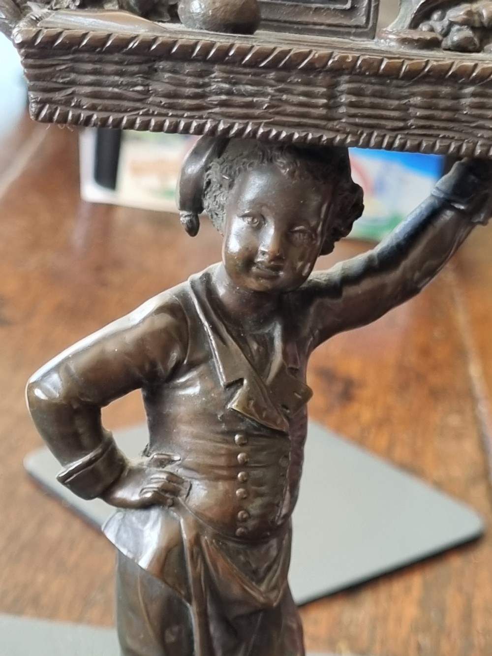 LATE 19THC ENDEARING BRONZE OF A BOY MATCHSTRIKER. View IV