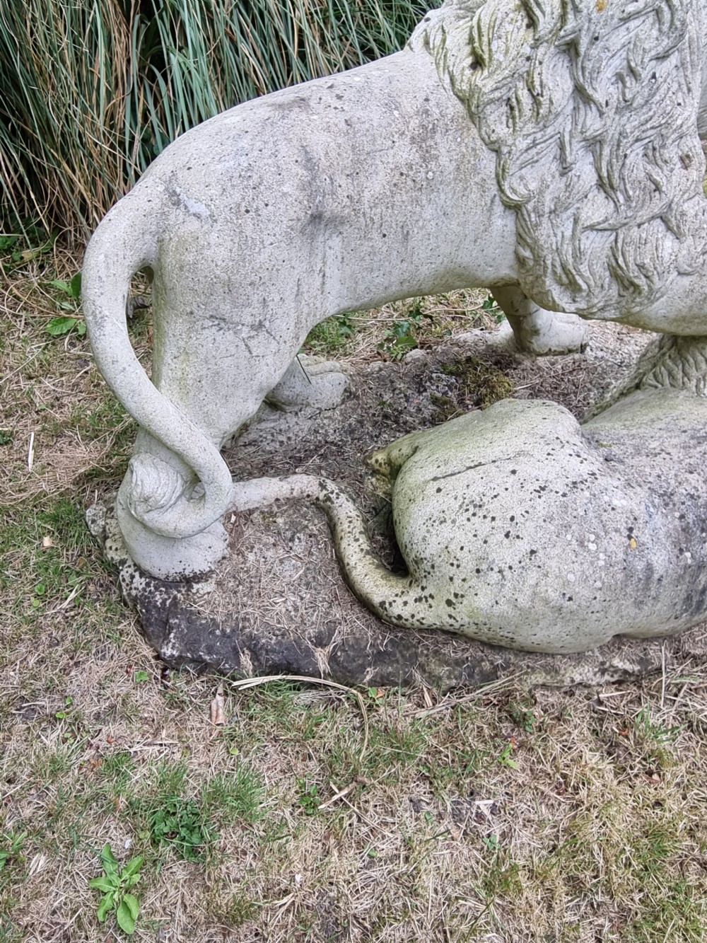 A weathered 19th-century Italian carved marble garden sculpture depicting roaring lions. View V