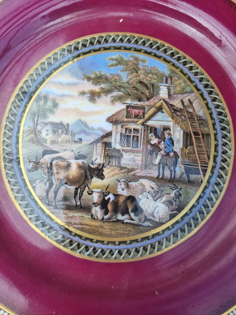 A collection of five 19th-century Prattware earthenware plates featuring central pictorial transfer prints enclosed by maroon and teal borders with gilded detailing. View VII