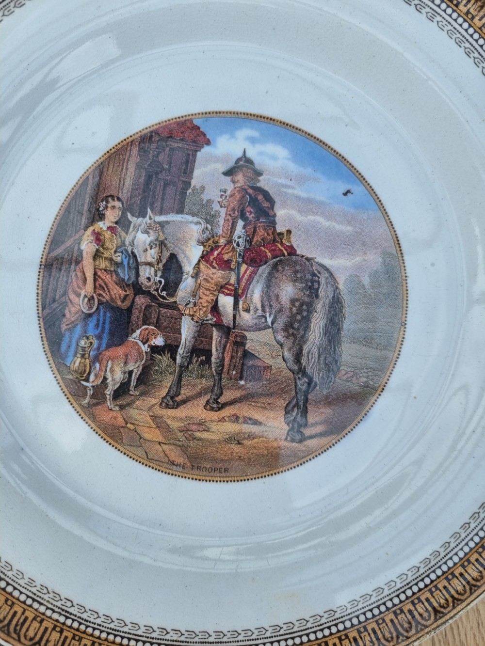 A set of five circular Victorian Prattware ceramic plates featuring polychrome transfer-printed pastoral landscape scenes with decorative gold geometric borders. View III