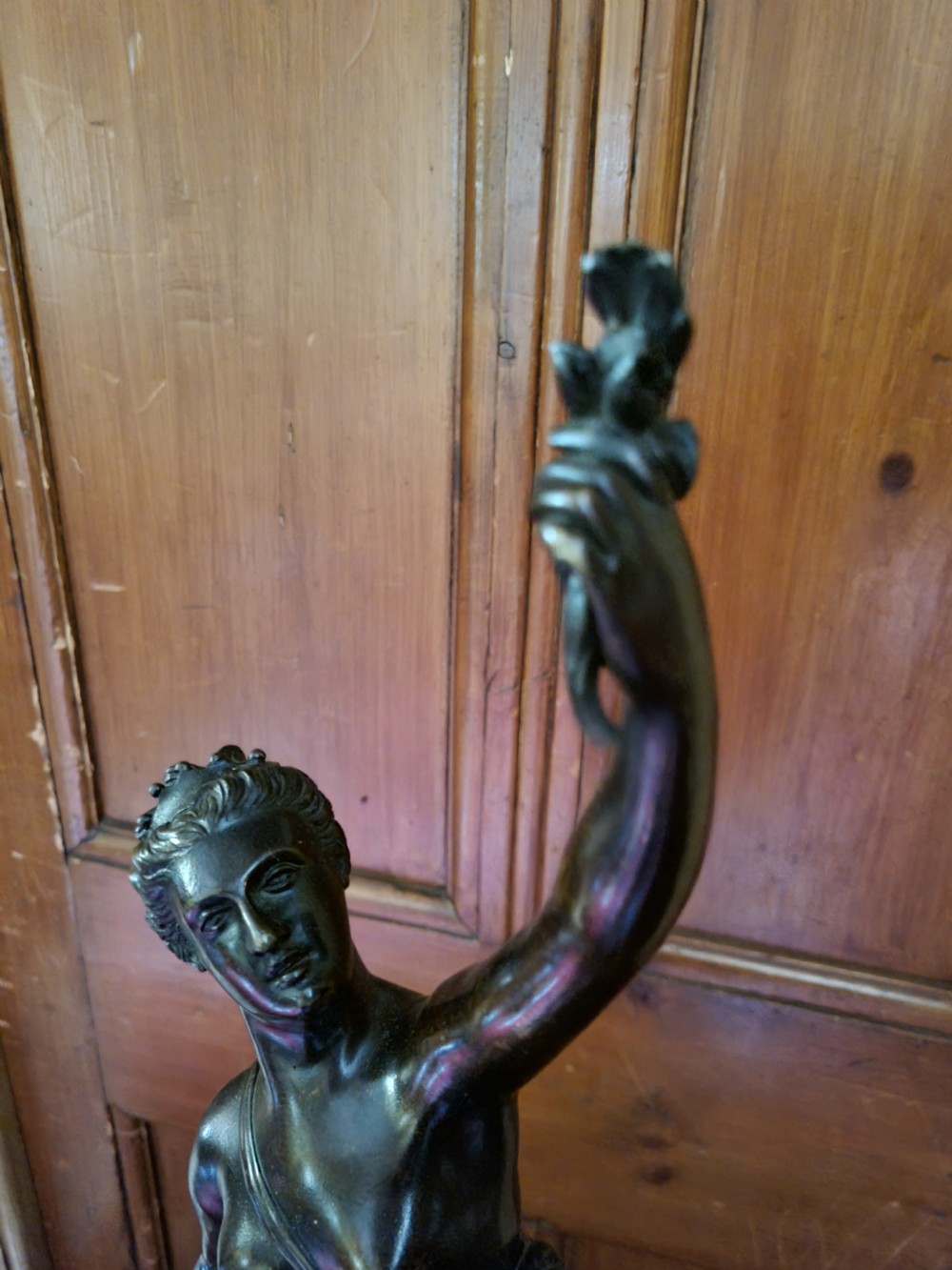 A dark patinated bronze figure depicting the allegorical figure of Fortuna mounted atop a cylindrical plinth. View V