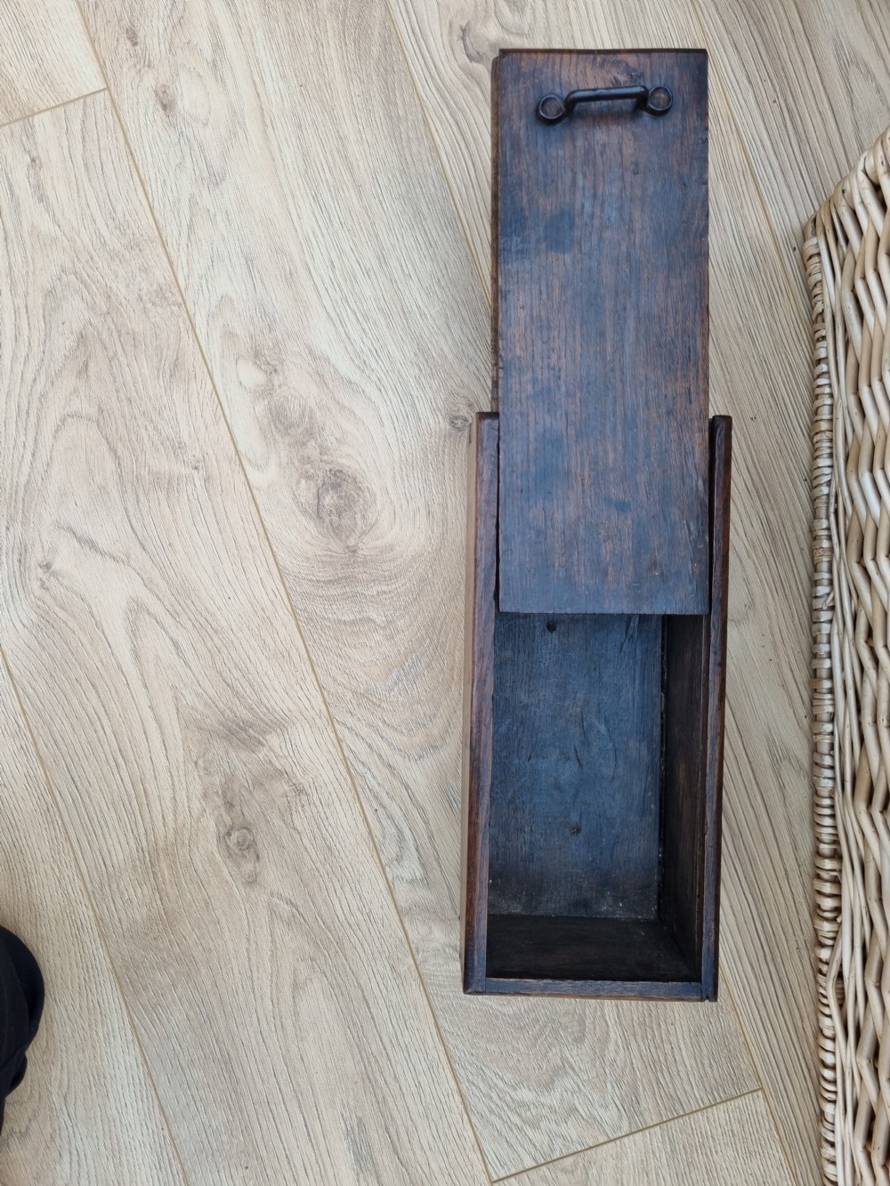 A rectangular dark oak primitive hanging candle box featuring a sliding lid with an iron handle. View III