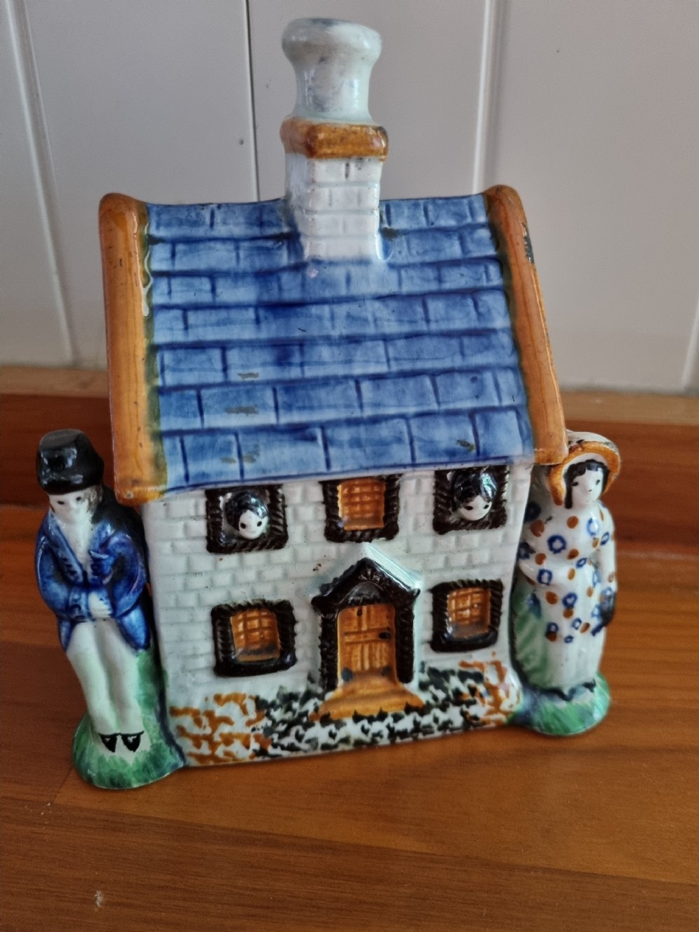 EARLY 19THC POTTERY MONEYBOX IN THE FORM OF A HOUSE
