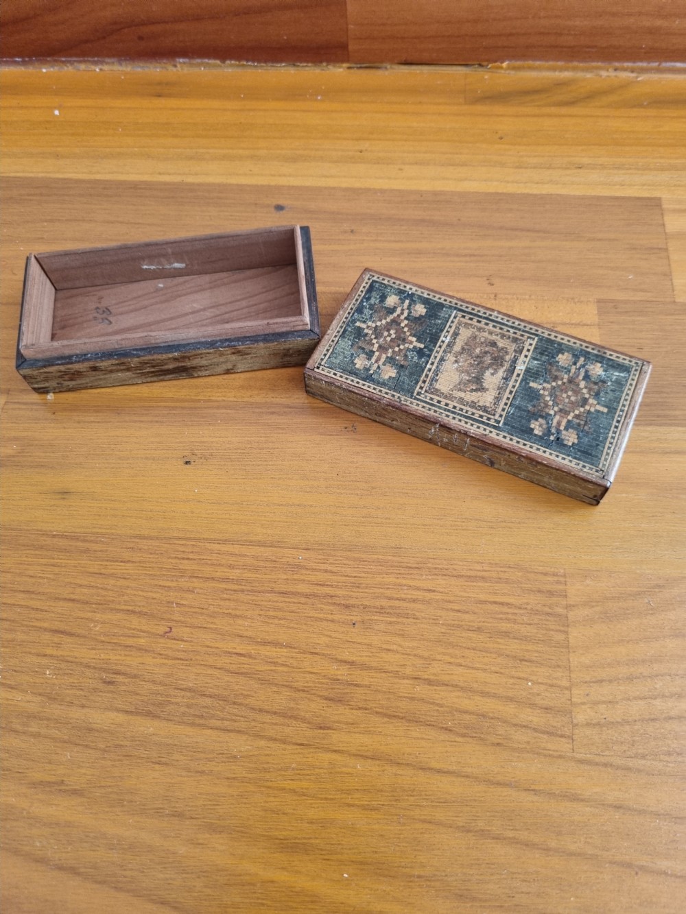 A rectangular nineteenth-century wooden stamp box featuring a detailed Tunbridge ware micro-mosaic lid with a profile silhouette of Young Queen Victoria flanked by geometric mosaic patterns. View III