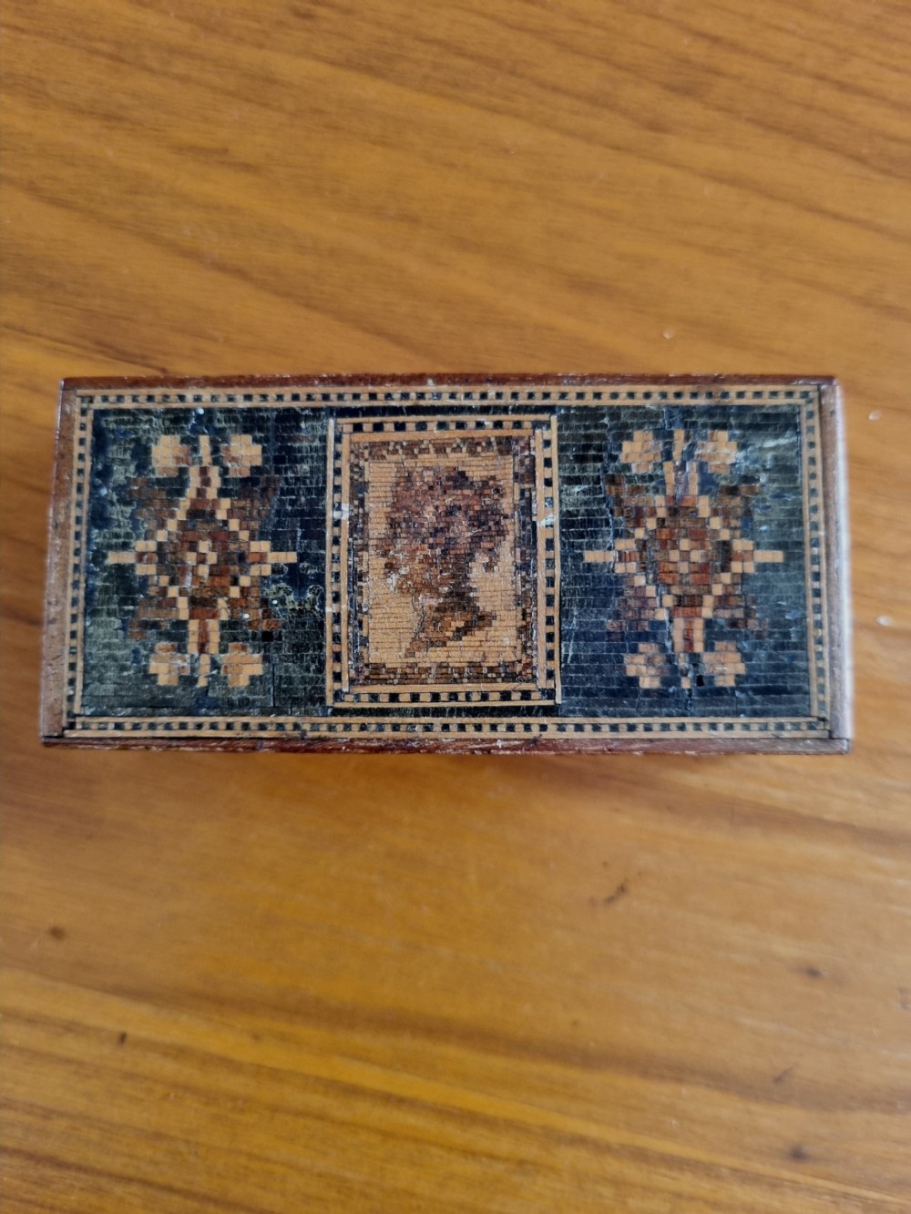 A rectangular nineteenth-century wooden stamp box featuring a detailed Tunbridge ware micro-mosaic lid with a profile silhouette of Young Queen Victoria flanked by geometric mosaic patterns. View IV