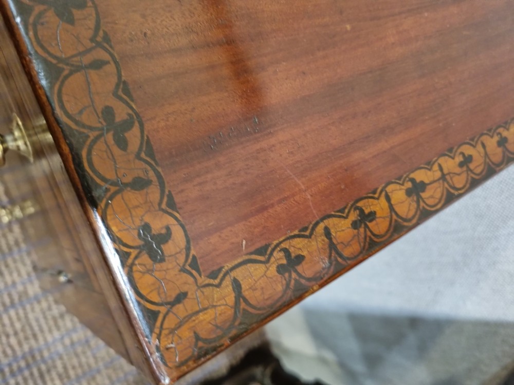 A Georgian mahogany night commode featuring intricate marquetry urn inlay on the main cupboard door, decorative floral border inlays, ceramic knobs, and a shaped base stretcher with a circular opening. View VII