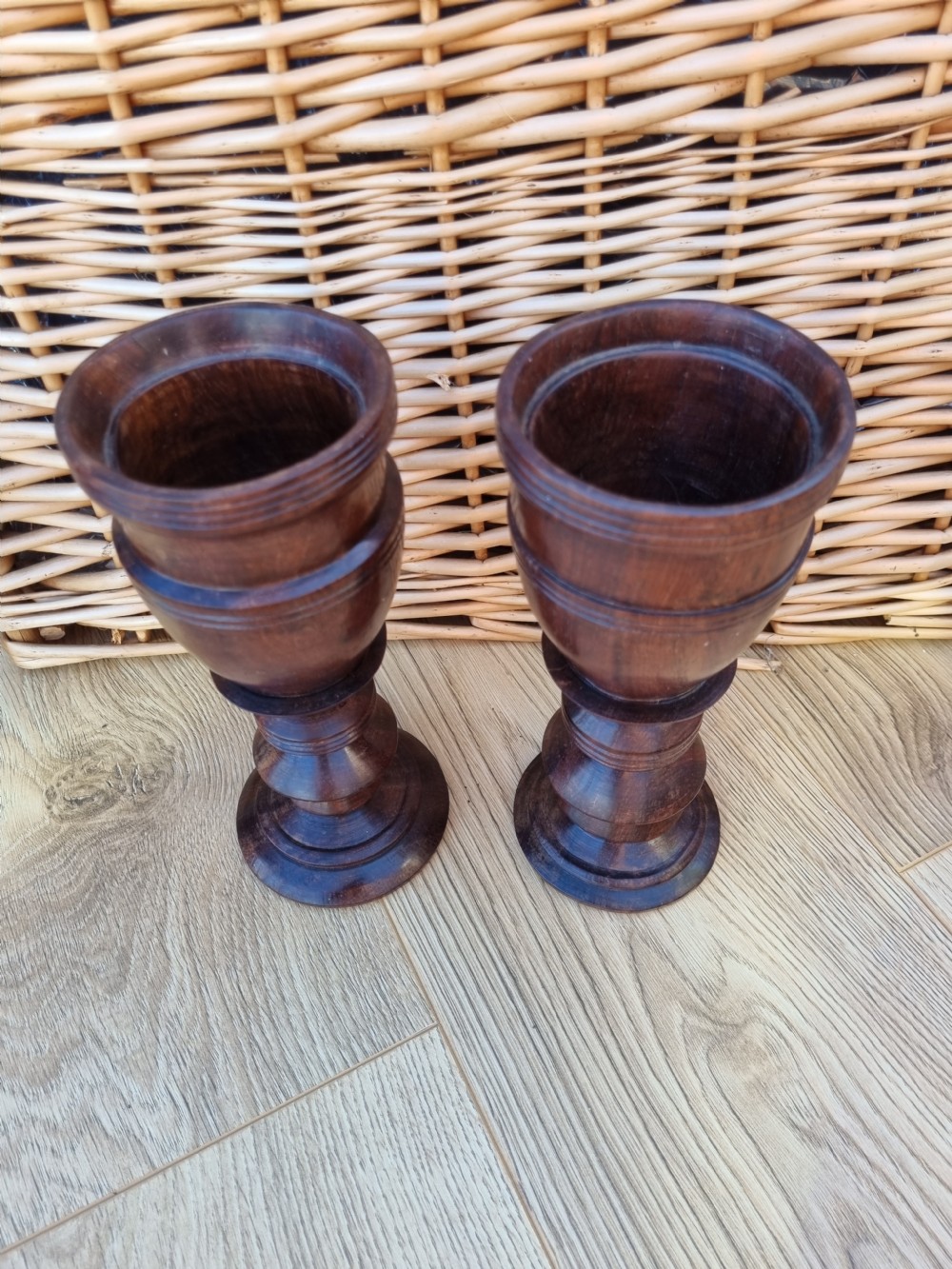 A pair of turned dark walnut goblets featuring stepped stems and moulded rim details. View III