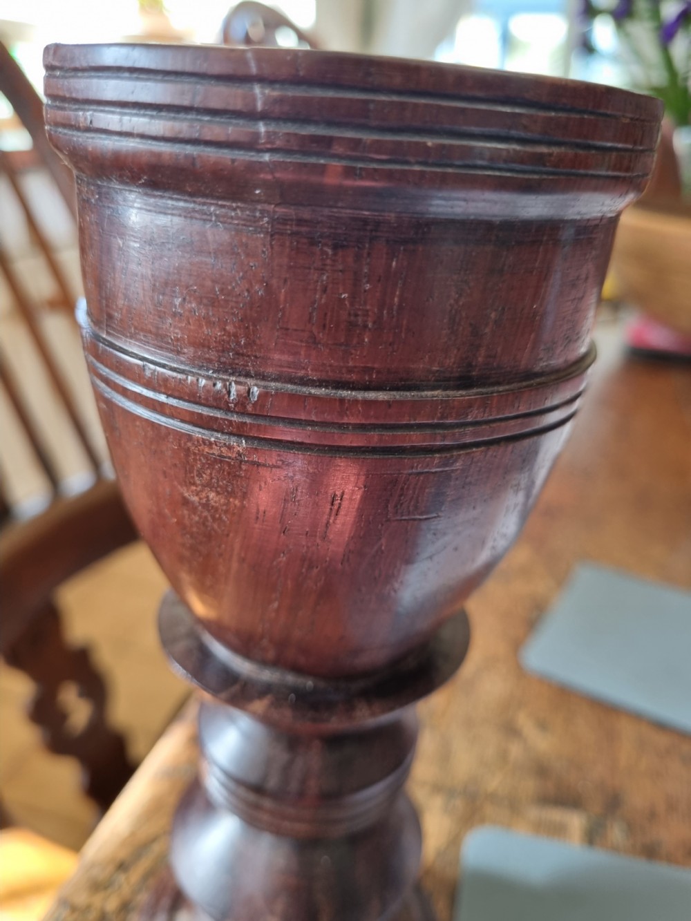A pair of turned dark walnut goblets featuring stepped stems and moulded rim details. View V