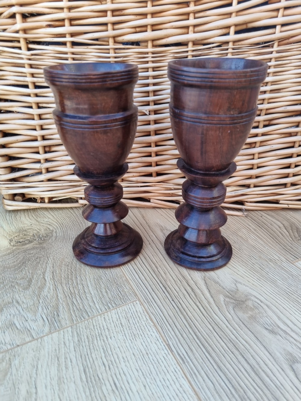 A pair of turned dark walnut goblets featuring stepped stems and moulded rim details. View VI