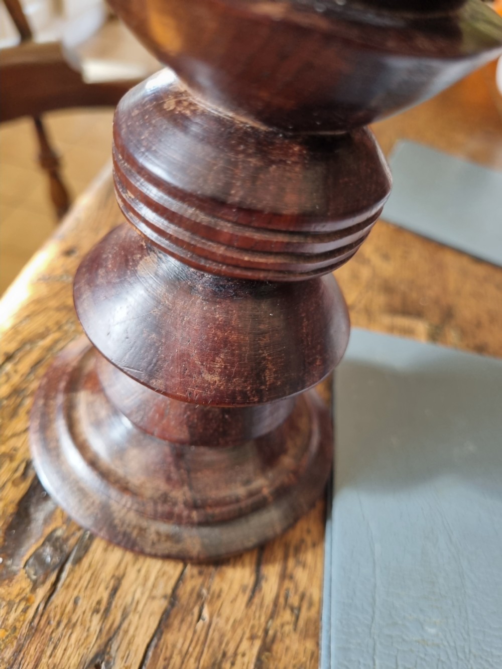 A pair of turned dark walnut goblets featuring stepped stems and moulded rim details. View VII