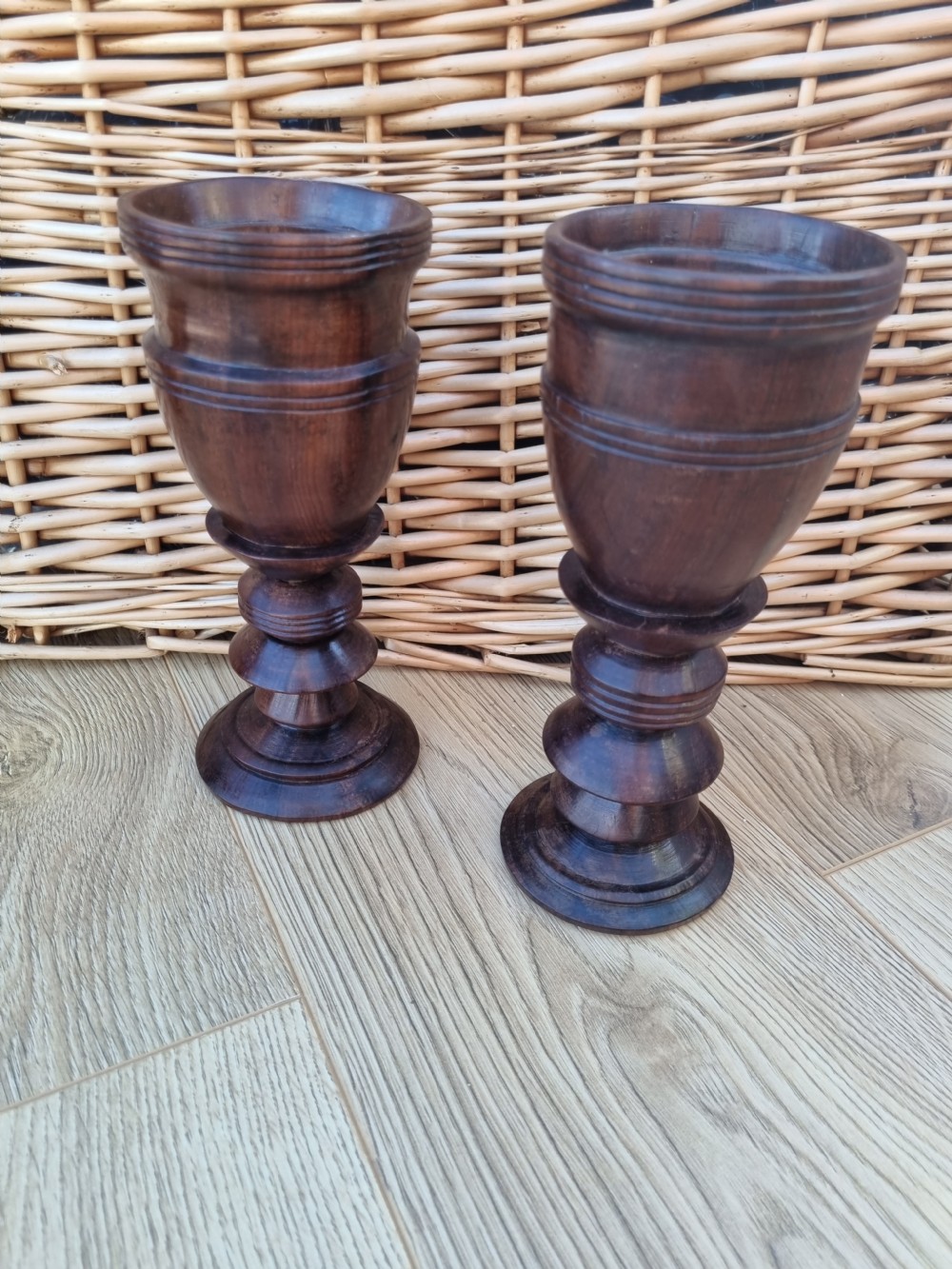 A pair of turned dark walnut goblets featuring stepped stems and moulded rim details. View VIII