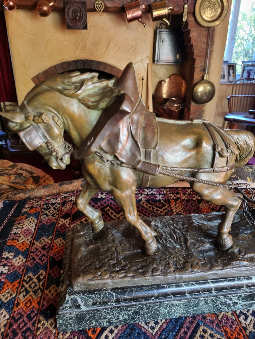A late 19th-century patinated bronze sculpture depicting a harnessed horse pulling a stone quarry sled alongside a worker, mounted on a green marble base. View II