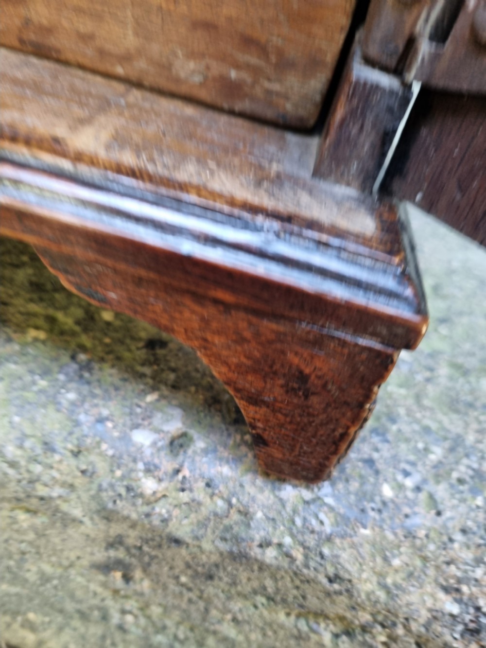 An 18th-century dark oak spice cupboard featuring a single door with a fielded raised panel and a brass oval escutcheon. View VIII