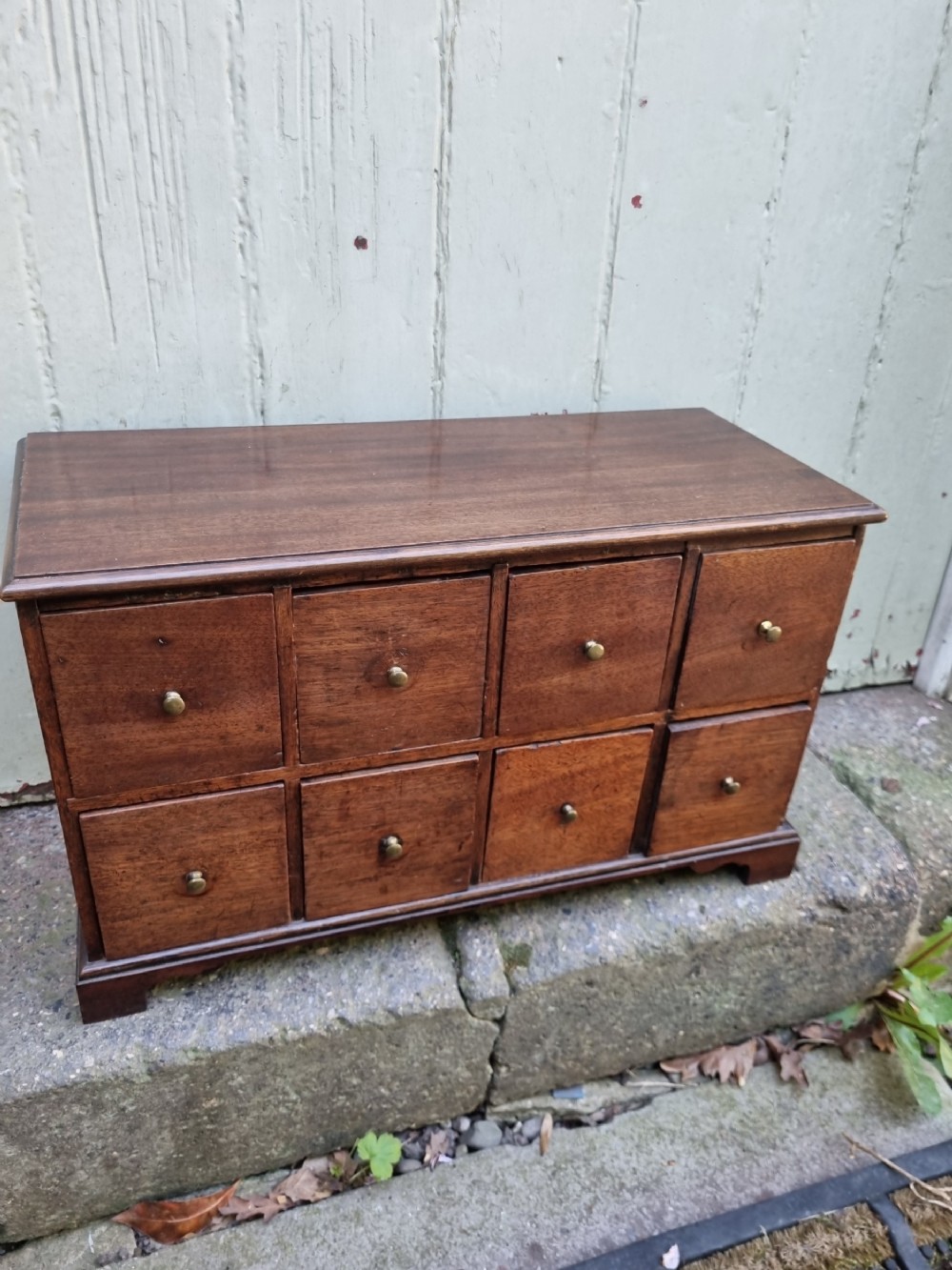 A GEORGIAN SET OF 8 FRUITWOOD SPICE DRAWERS 