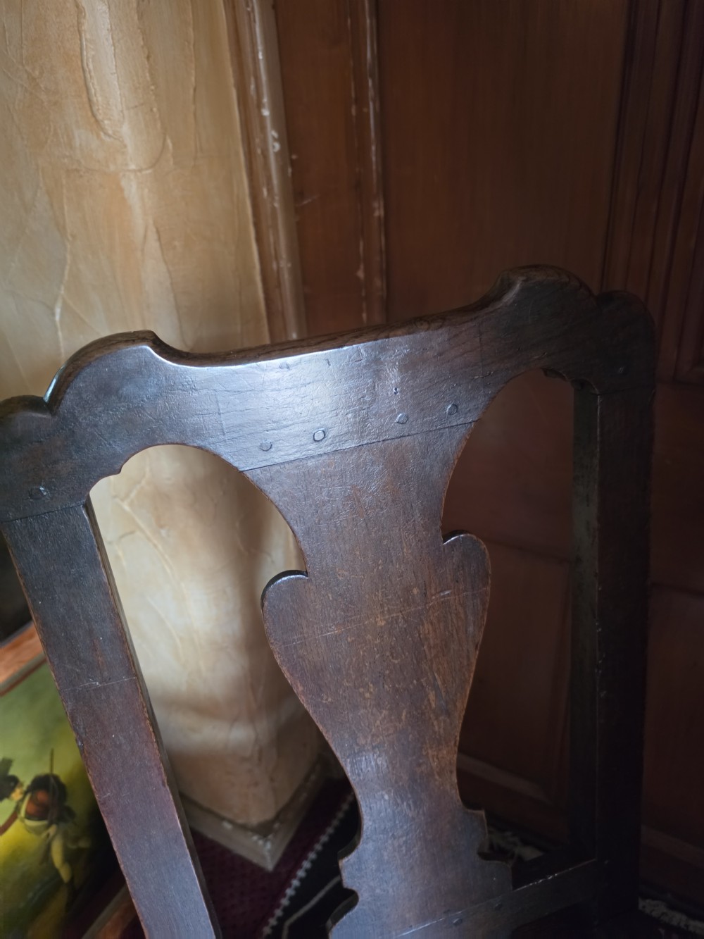 An 18th-century dark oak side chair featuring a vase-shaped splat back, solid timber seat, and turned front legs and stretcher. View III