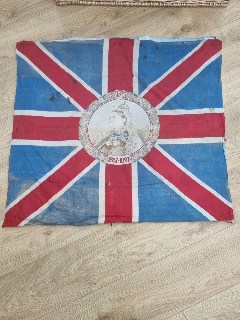 A square printed Union Jack flag featuring a central circular portrait of Queen Victoria inscribed with the dates 1837 to 1897.