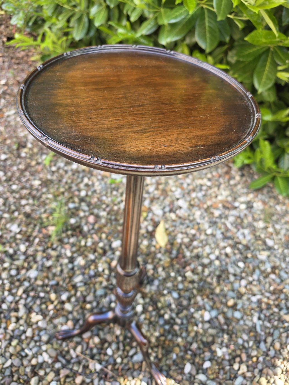 A tall mahogany plant stand with a circular dished top, reeded central column, and tripod cabriole legs ending in claw and ball feet. View IV