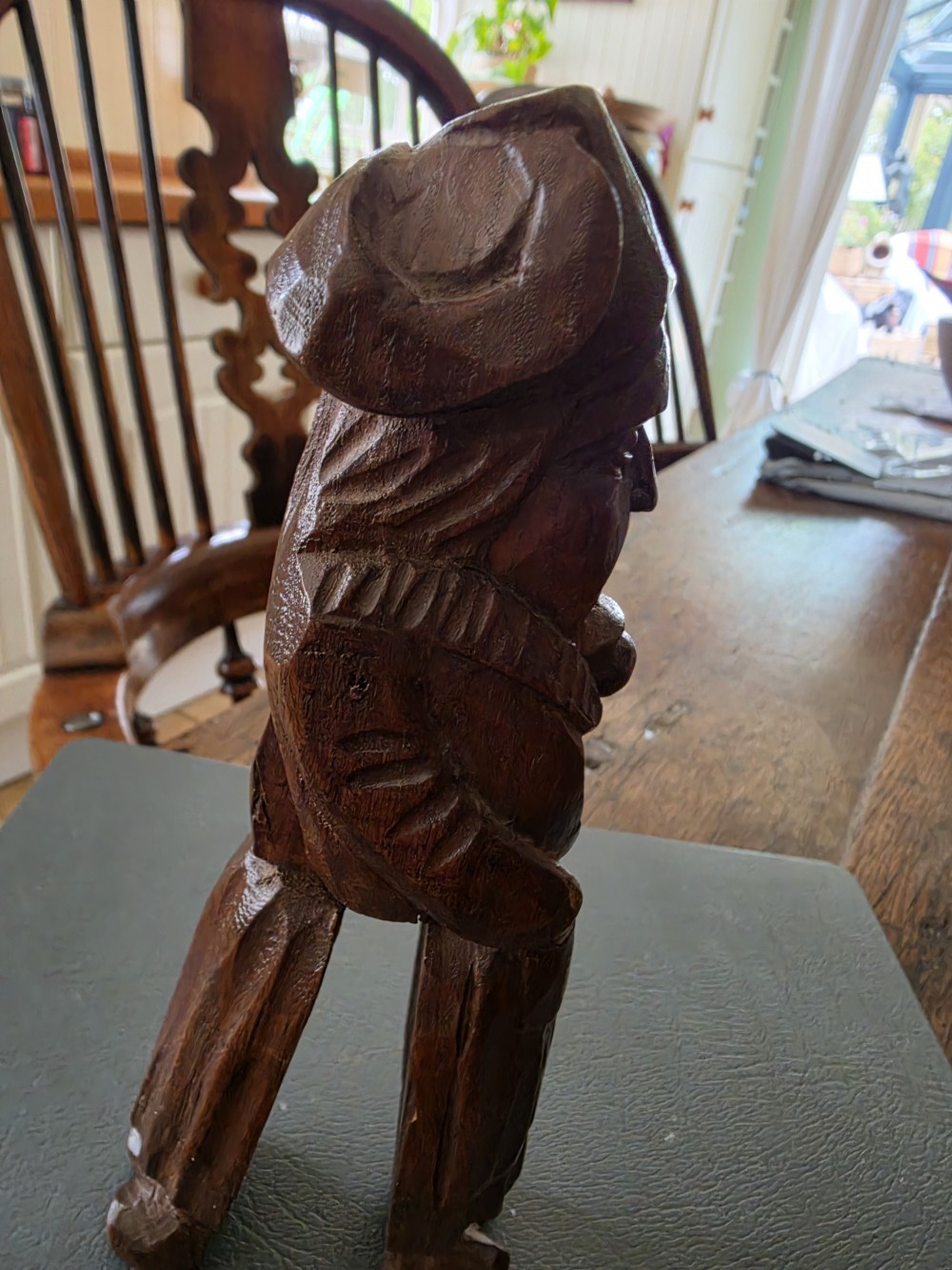 A hand-carved dark oak nutcracker depicting a standing human figure with an open mouth mechanism. View IV