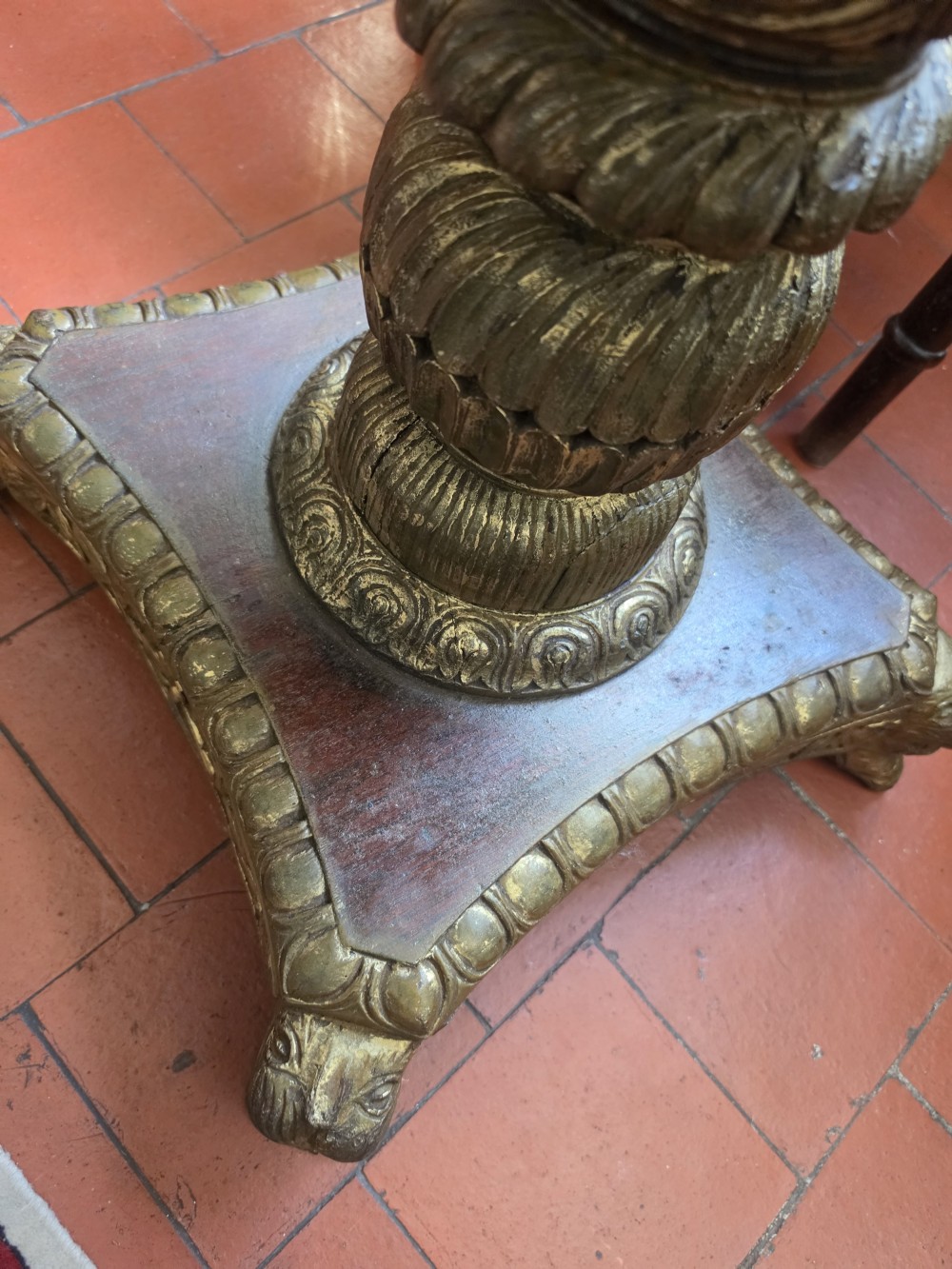 A pair of 19th-century occasional tables featuring square black marble tops inlaid with colourful pietra dura chessboard patterns and floral borders on carved giltwood pedestal bases. View IV