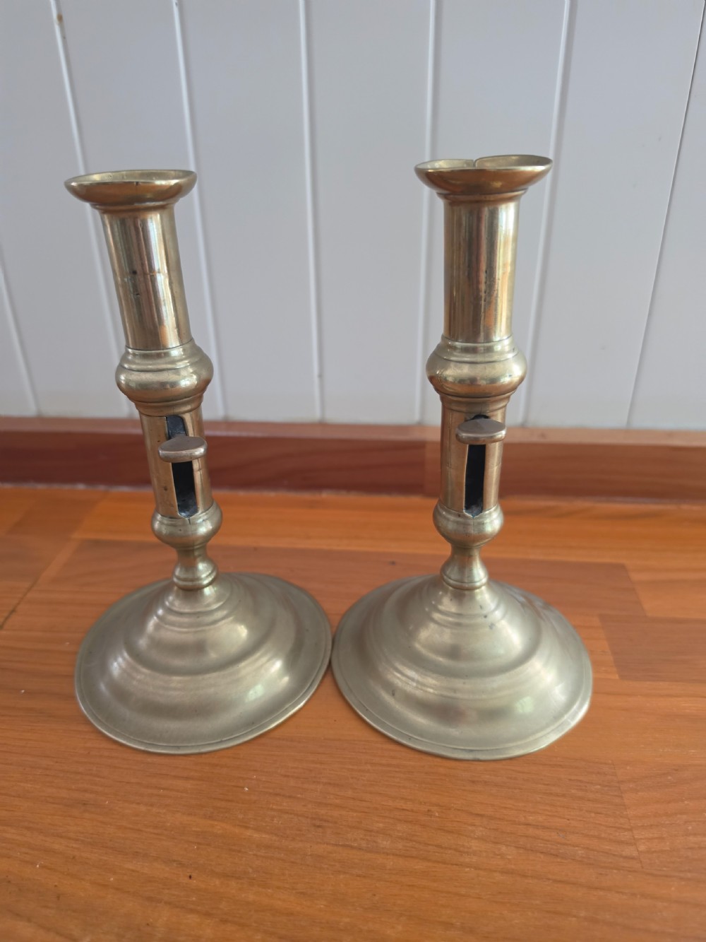 MID 18THC PAIR OF SEAMED BRASS EJECTOR CANDLESTICKS
