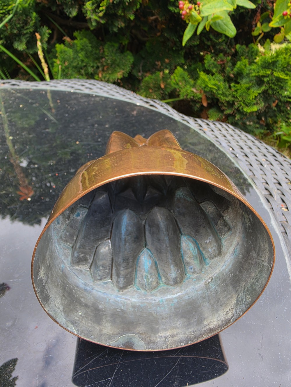 A tiered Victorian copper jelly mould featuring geometric fluted and arched column details. View III