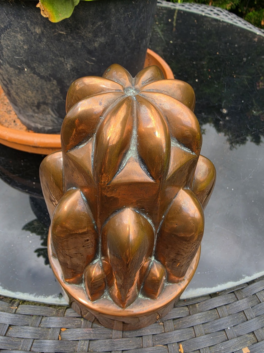 A tiered Victorian copper jelly mould featuring geometric fluted and arched column details. View IV
