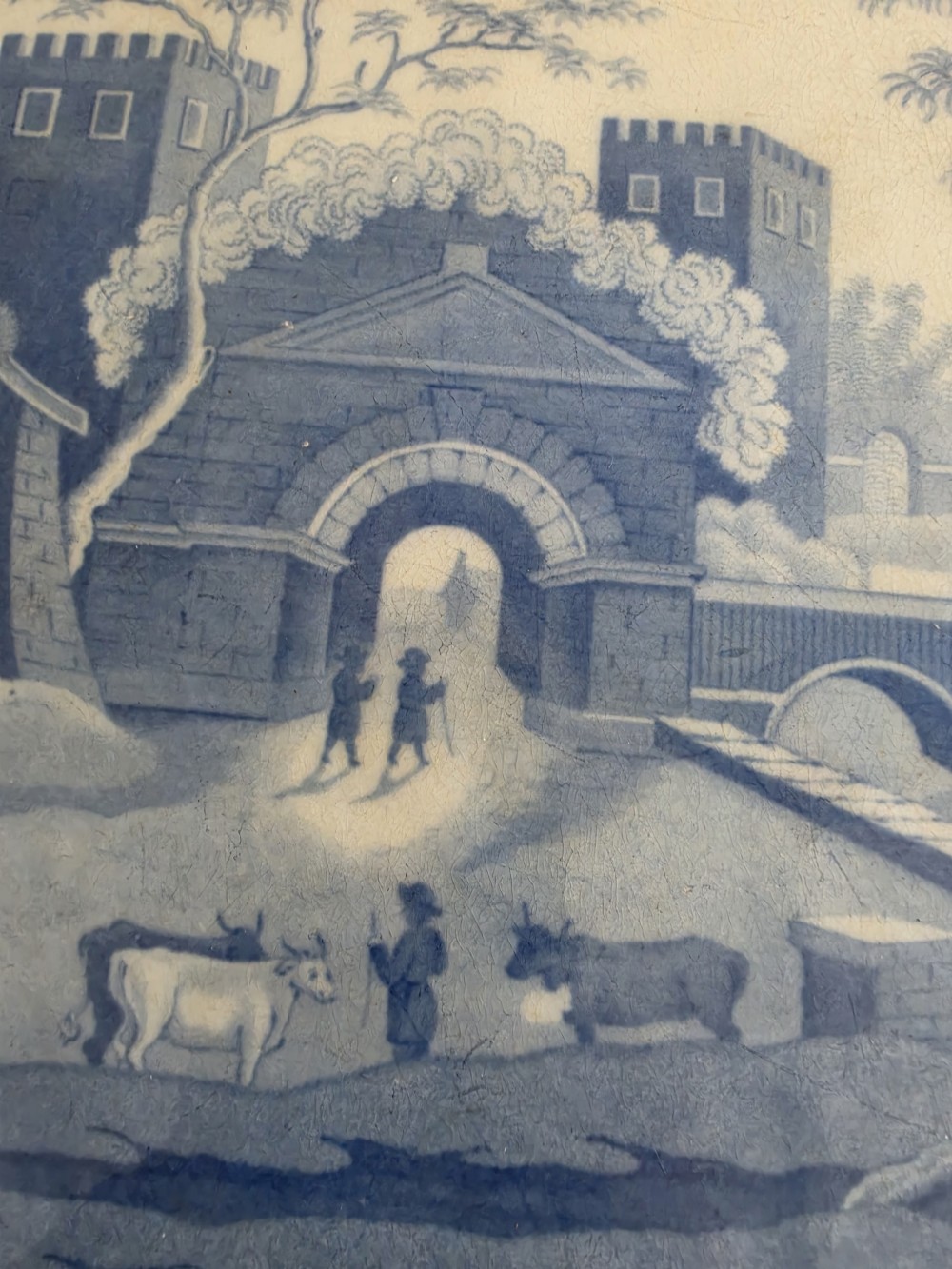 An early 19th-century octagonal Spode blue and white transferware meat platter featuring a detailed architectural landscape and floral border. View IV